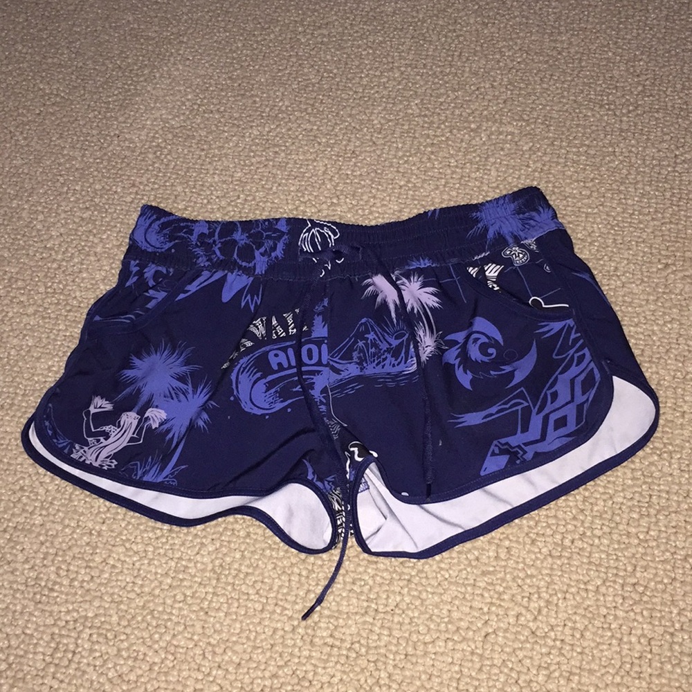 Blue shorts with palm tree Aloha design.
